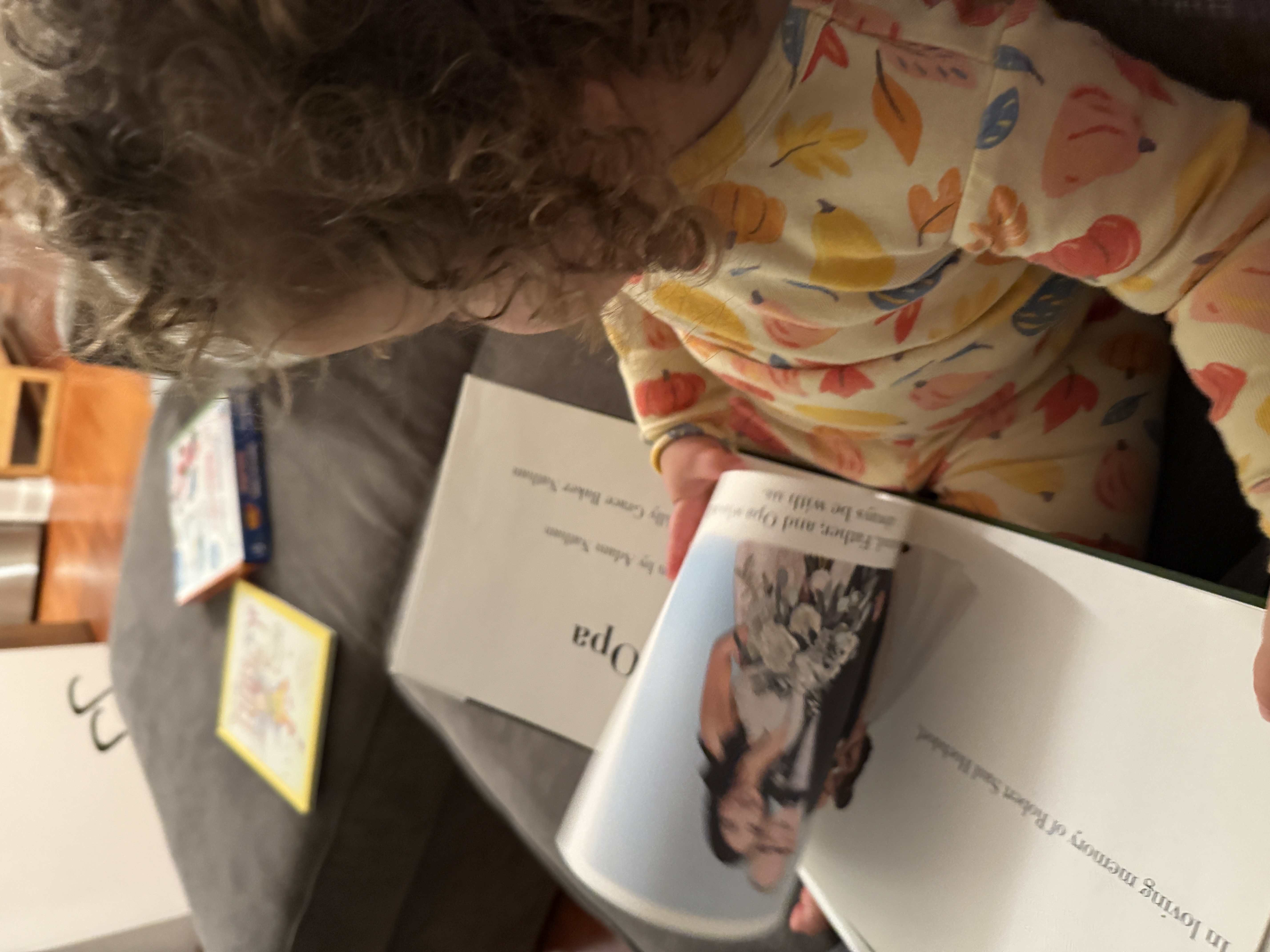 Ruby and Shoshana reading an Opa Project book together
